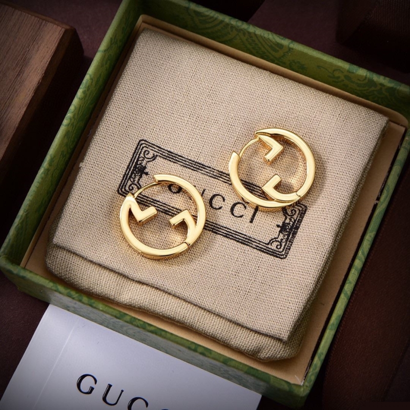 G*u*i earrings